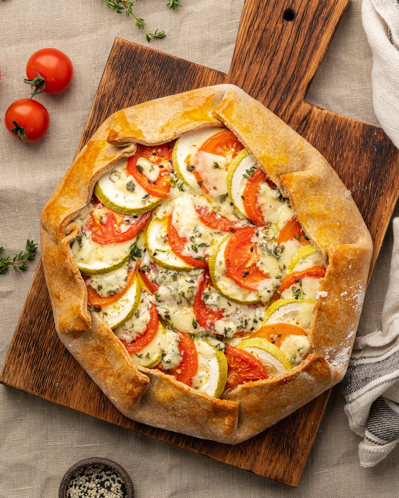 Homemade savory galette with vegetables, wheat pie with toma